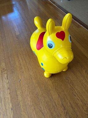 Yellow Ride-On Hopper Toy with Red Heart Accent